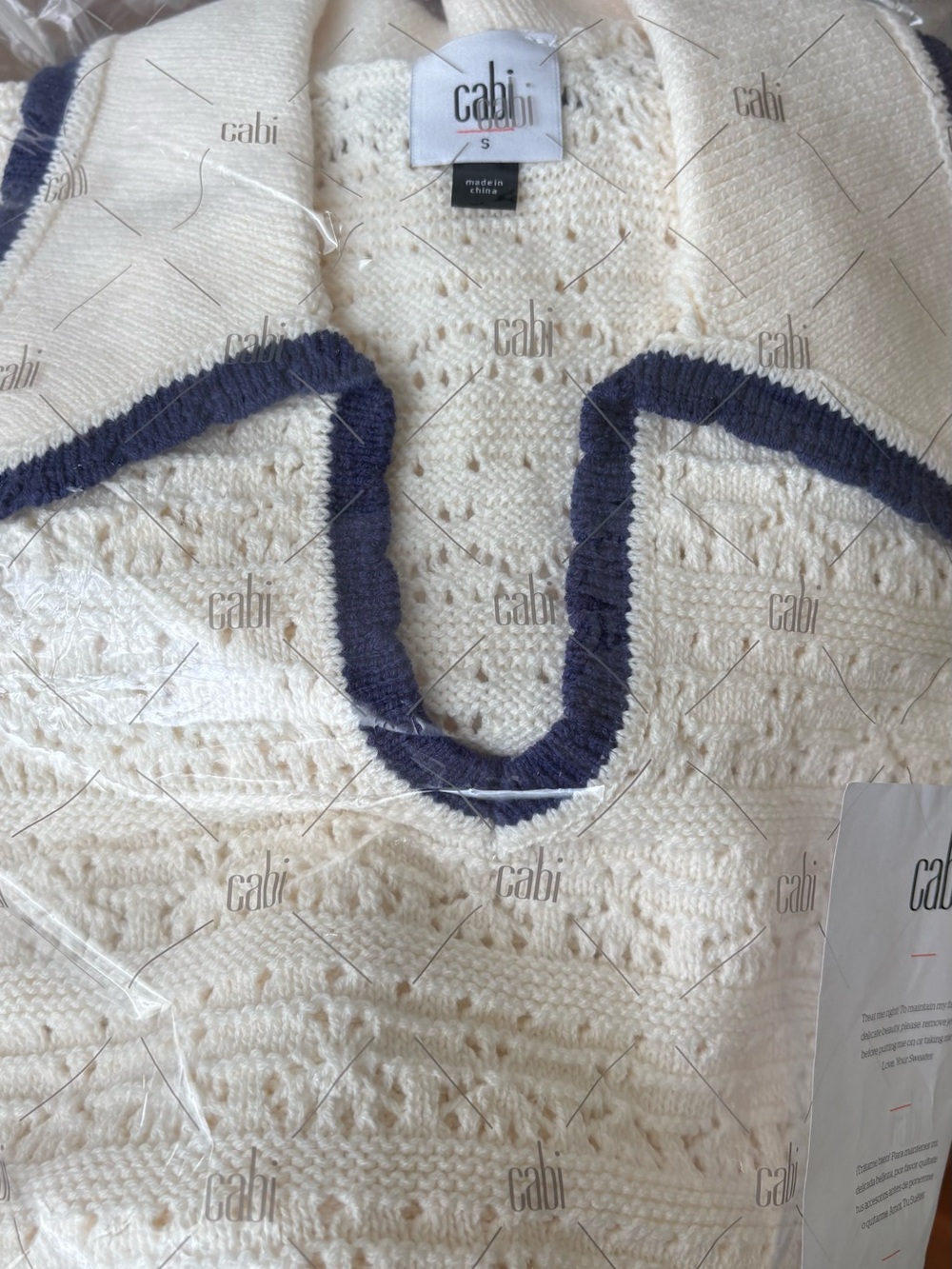 CAbi Cream Loom pull over V-Neck Sweater with Navy Trim